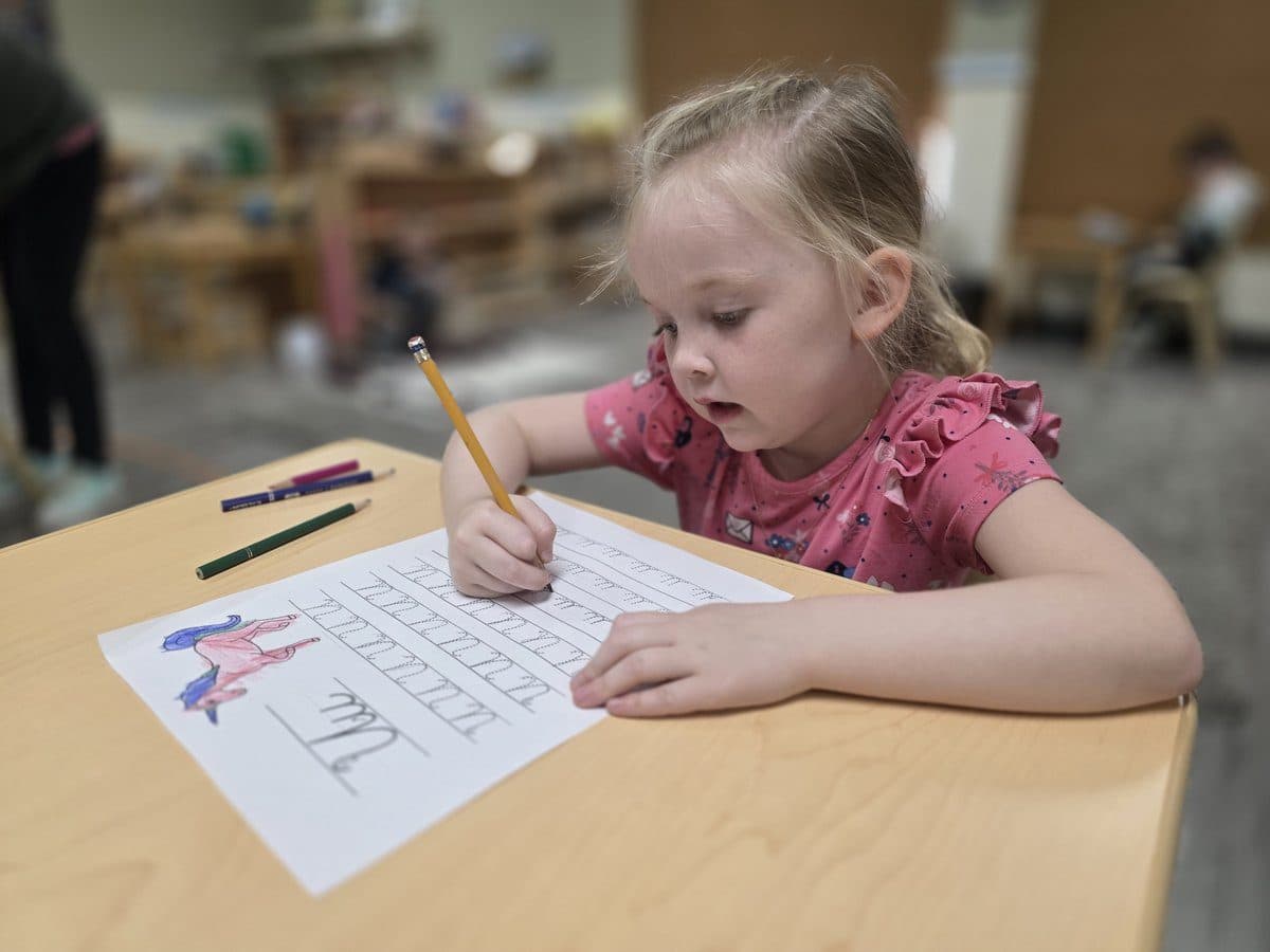 Amici kindergarten student practising handwriting